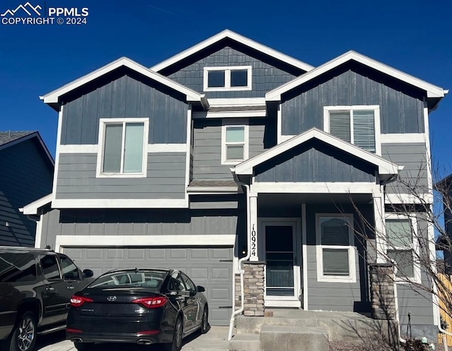 craftsman inspired home with a garage