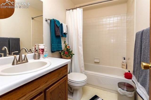 full bathroom featuring vanity, shower / bath combo, and toilet