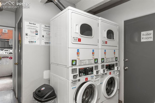 laundry area featuring washer and dryer and stacked washer and clothes dryer