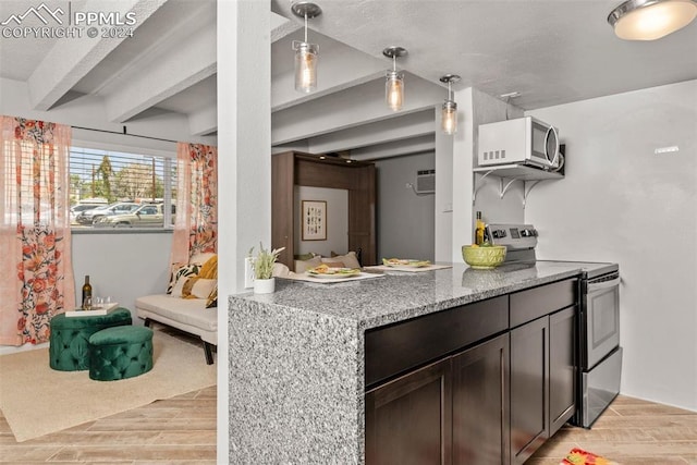 kitchen featuring light stone countertops, decorative light fixtures, dark brown cabinets, appliances with stainless steel finishes, and light wood-type flooring