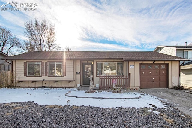 single story home featuring a garage