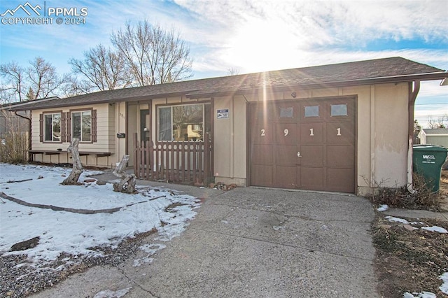 ranch-style home with a garage