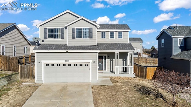 front of property with covered porch and a garage