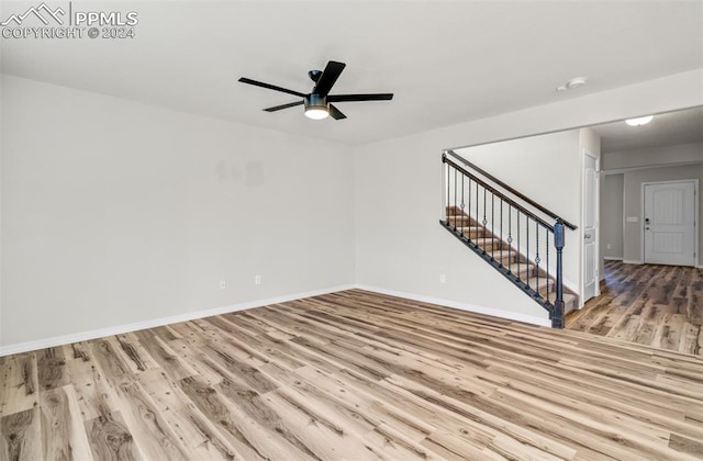 unfurnished room featuring light hardwood / wood-style floors and ceiling fan