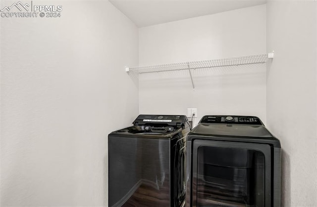 laundry area with separate washer and dryer