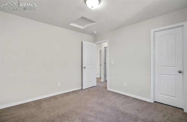 unfurnished bedroom featuring light colored carpet