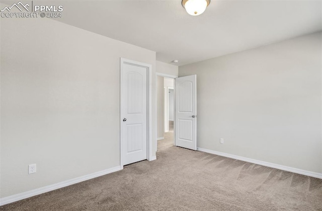 unfurnished bedroom with carpet flooring