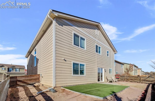 back of house featuring a patio area