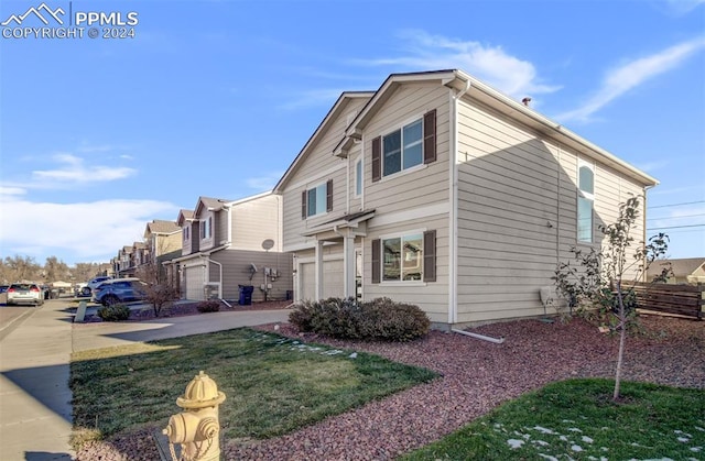 view of front of property with a garage and a front yard