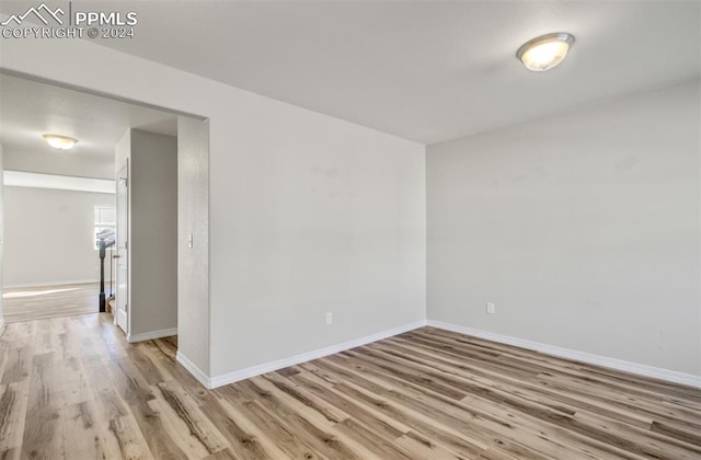 spare room featuring light wood-type flooring