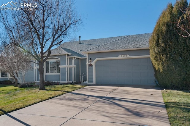 ranch-style home with a garage and a front yard