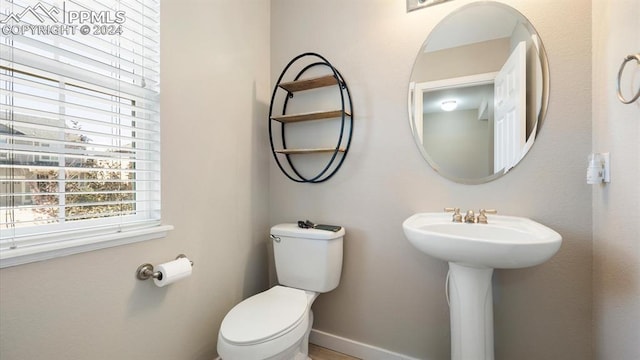 bathroom featuring toilet and sink