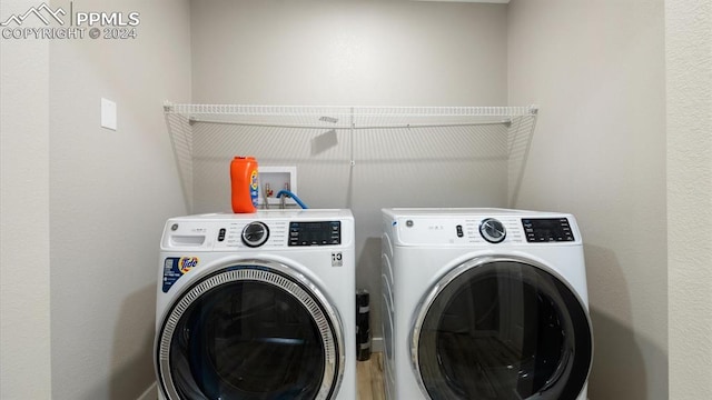 laundry area with washing machine and dryer