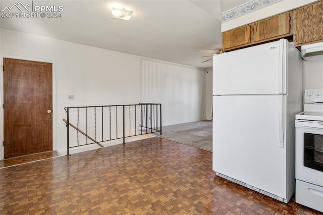 kitchen with dark parquet floors, ceiling fan, and white appliances