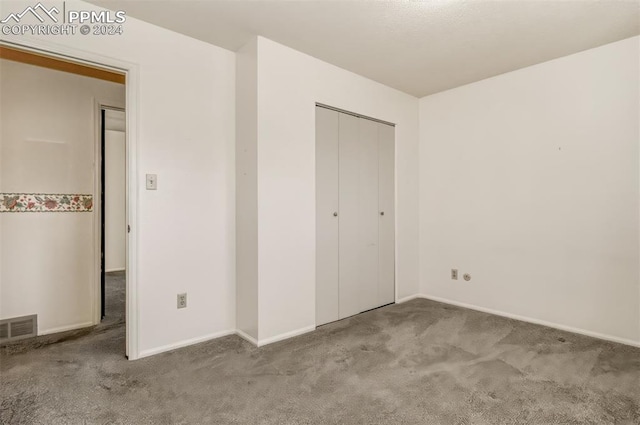 unfurnished bedroom with light carpet