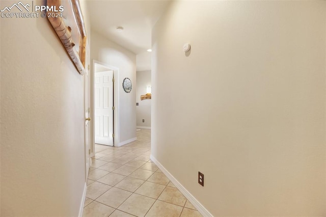 corridor with light tile patterned flooring