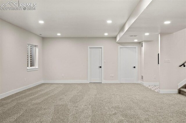 basement with light colored carpet