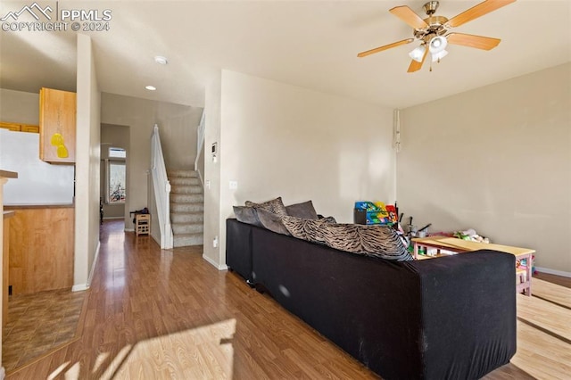 living room with ceiling fan and hardwood / wood-style floors