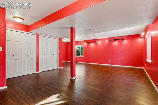 interior space with dark hardwood / wood-style flooring