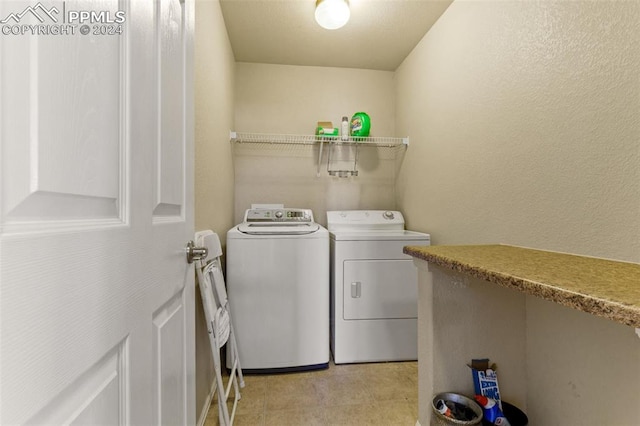 laundry room with washer and clothes dryer