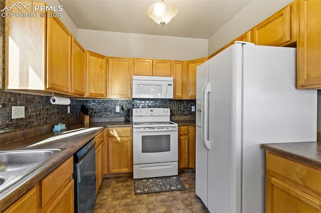 kitchen featuring decorative backsplash, white appliances, and sink