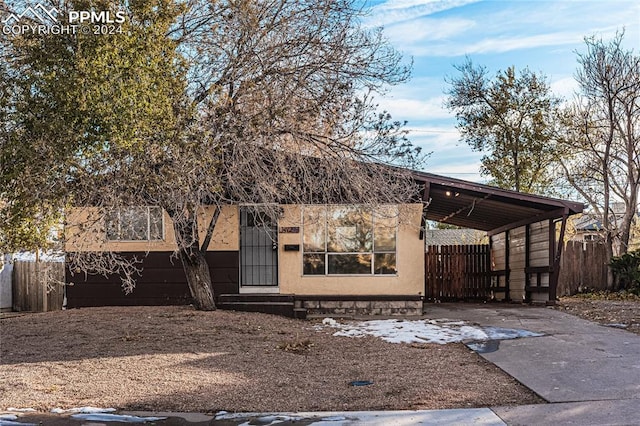 view of front of house featuring a carport