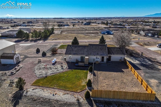 birds eye view of property with a mountain view