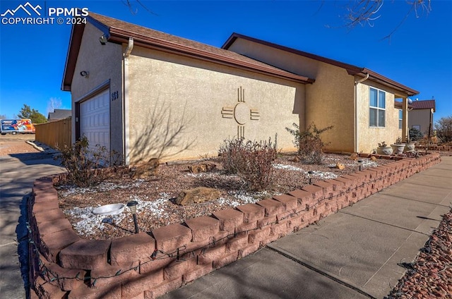 view of home's exterior with a garage