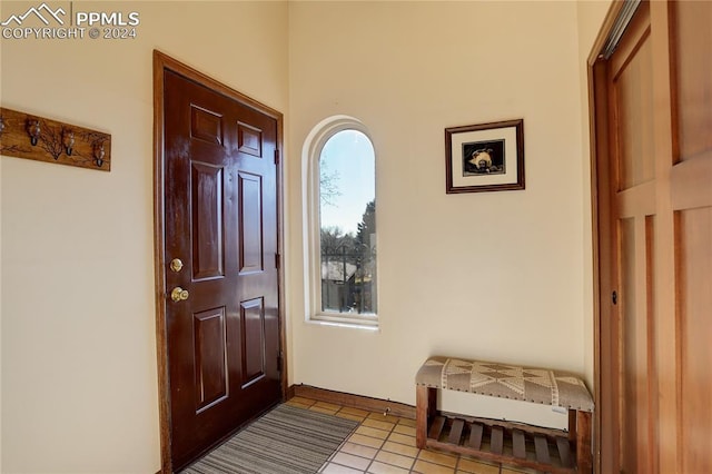 foyer with light tile patterned flooring