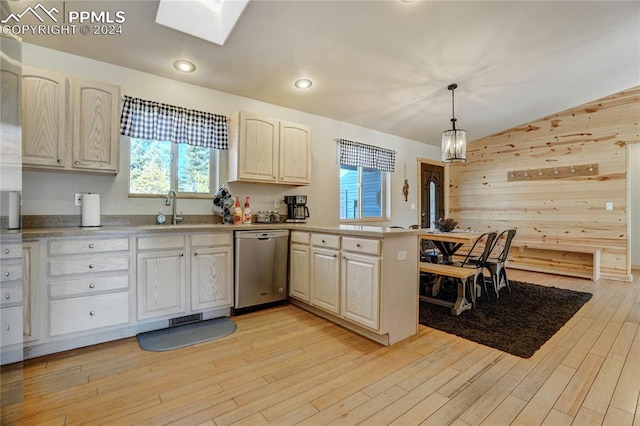 kitchen with dishwasher, light wood-type flooring, decorative light fixtures, and sink