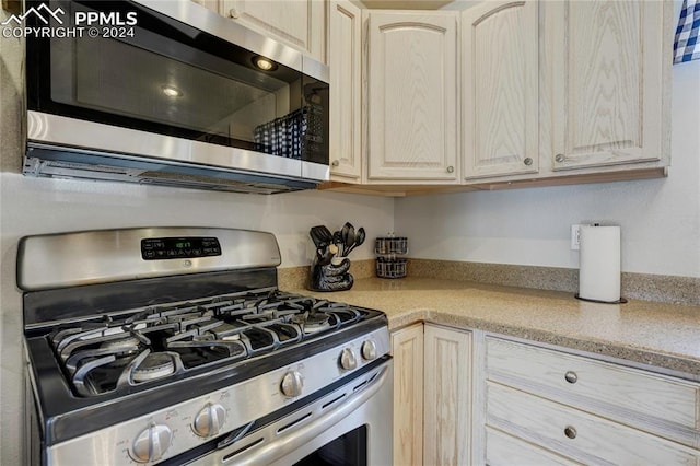 kitchen featuring appliances with stainless steel finishes and light brown cabinets