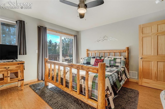 bedroom with light wood-type flooring and ceiling fan