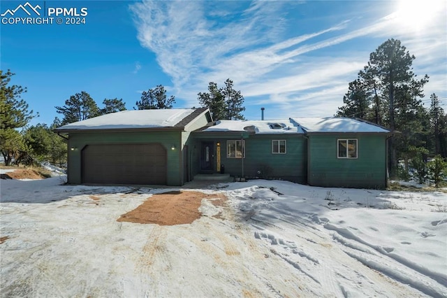 ranch-style home featuring a garage