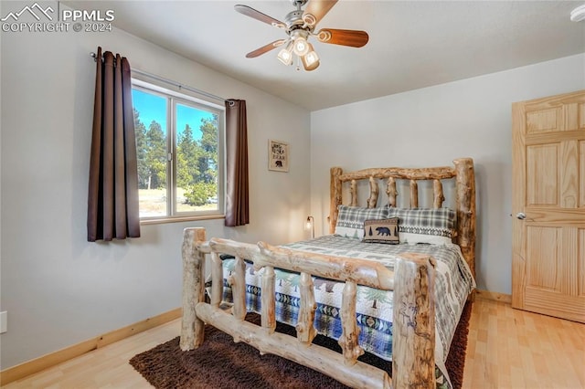 bedroom with ceiling fan and light wood-type flooring