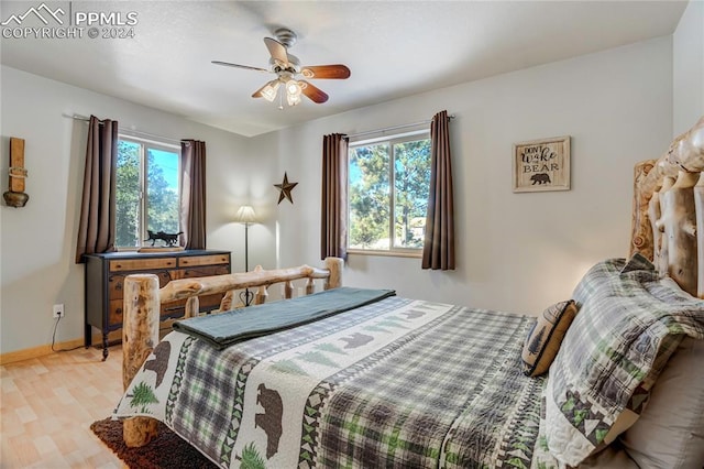 bedroom featuring light hardwood / wood-style flooring and ceiling fan