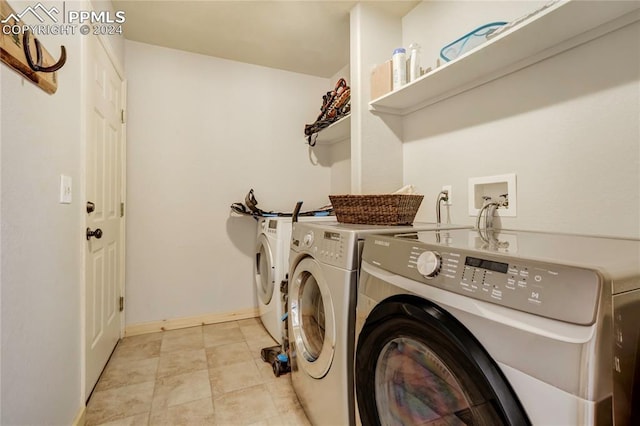 clothes washing area with washing machine and clothes dryer