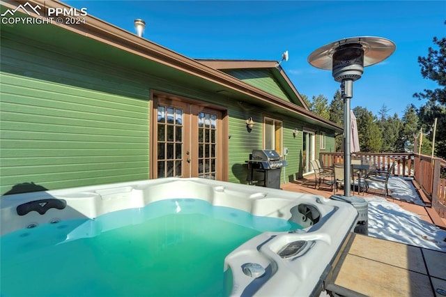 wooden terrace with grilling area and french doors