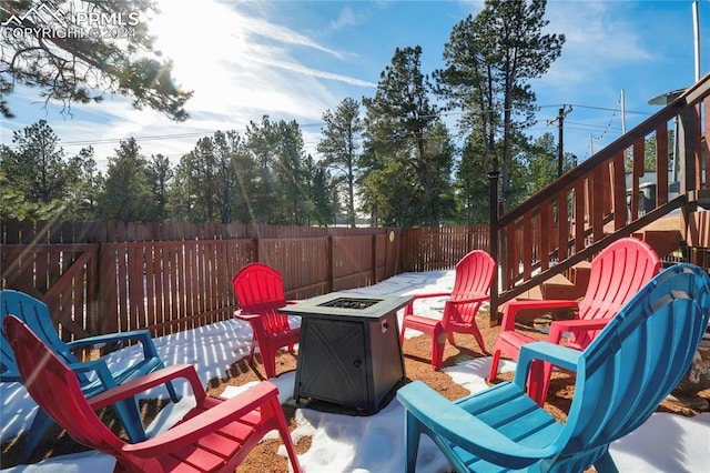 view of patio / terrace with a fire pit