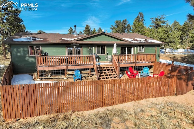 back of house with a wooden deck