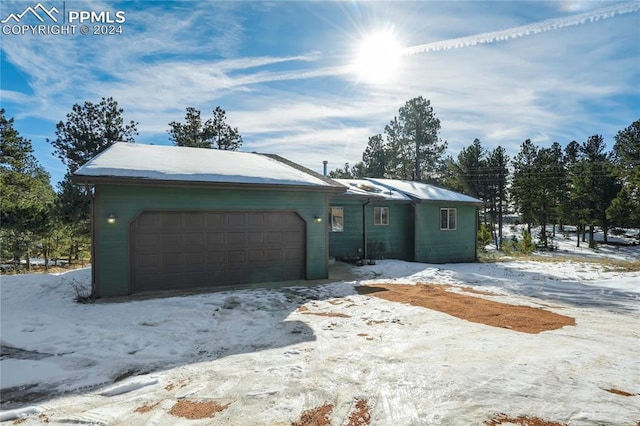 single story home with a garage