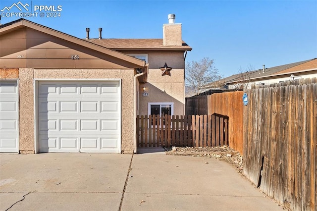 view of side of home with a garage