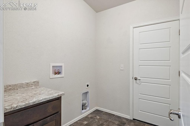 clothes washing area with hookup for an electric dryer and hookup for a washing machine