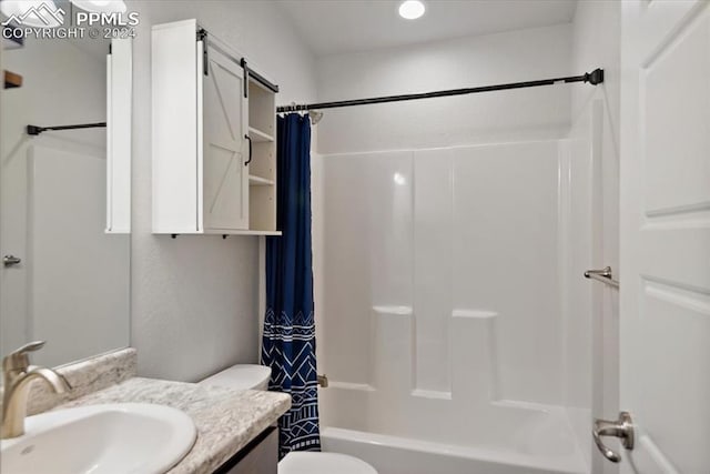 full bathroom with toilet, vanity, and shower / tub combo with curtain