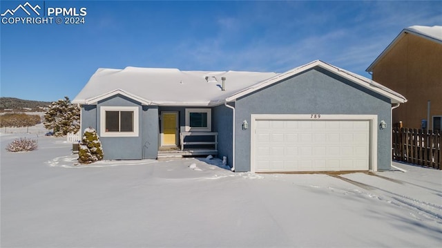 view of front of property featuring a garage