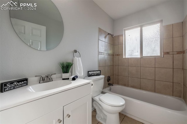 full bathroom featuring tile patterned floors, toilet, vanity, and tiled shower / bath