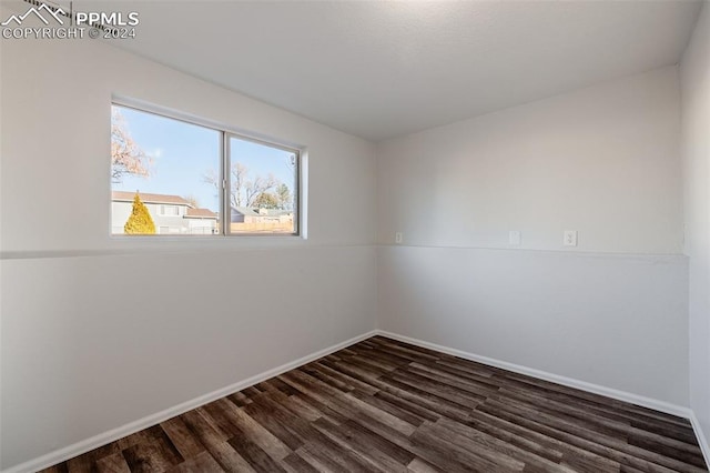 unfurnished room featuring dark hardwood / wood-style floors