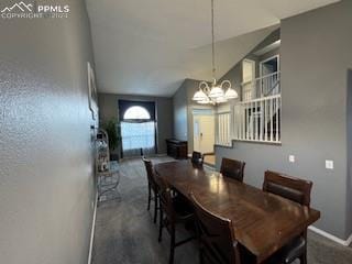 dining area featuring an inviting chandelier