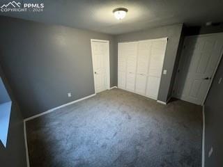 unfurnished bedroom featuring carpet