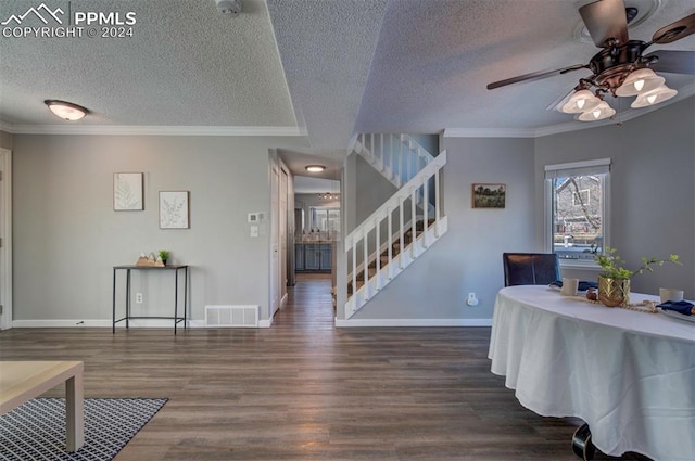 interior space with crown molding, dark hardwood / wood-style floors, a textured ceiling, and ceiling fan