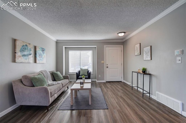 living room with ornamental molding, dark hardwood / wood-style floors, and a textured ceiling